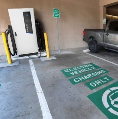 Pilot x Piwin DC EV Charging Station in a Canadian parking garage, designated for electric vehicles only.